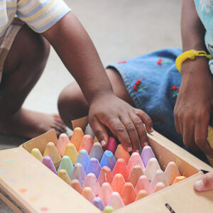 Children Playing with Color Chalks